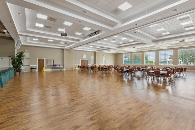 misc room with beam ceiling, wood finished floors, and coffered ceiling