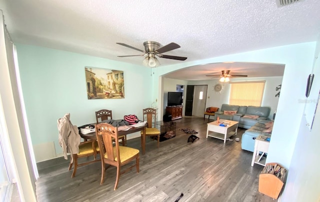 interior space with a textured ceiling, hardwood / wood-style flooring, and ceiling fan