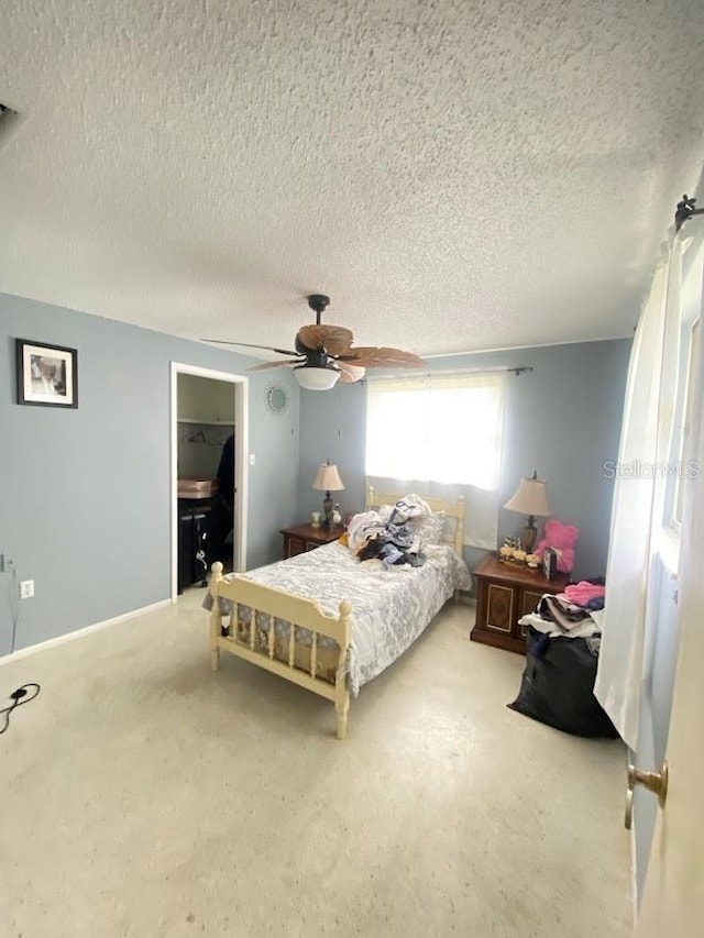 bedroom featuring a textured ceiling and ceiling fan