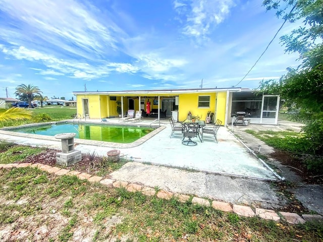 rear view of house with a patio