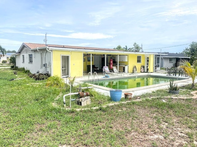 back of property featuring a patio