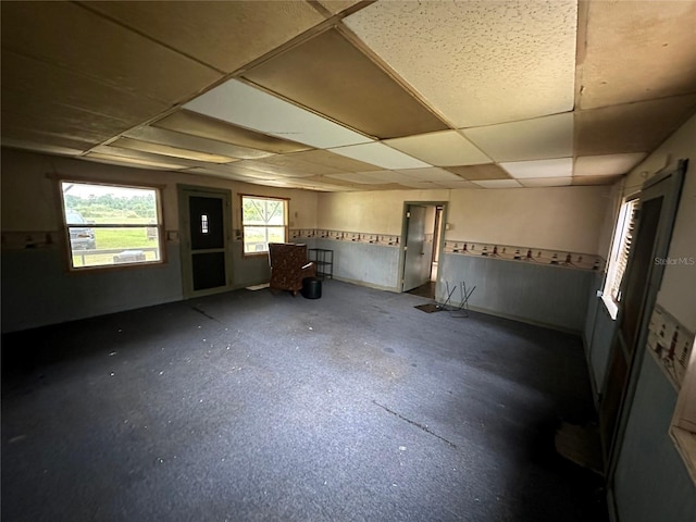 unfurnished room with a paneled ceiling