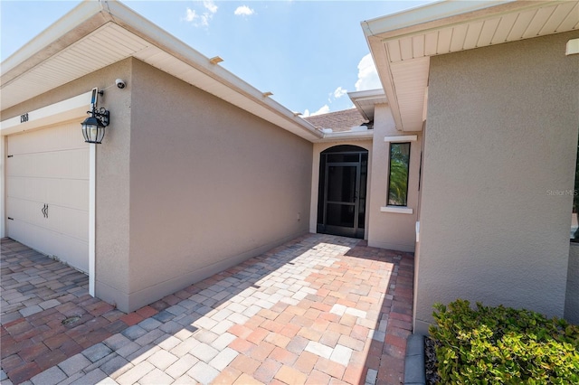 entrance to property with a patio