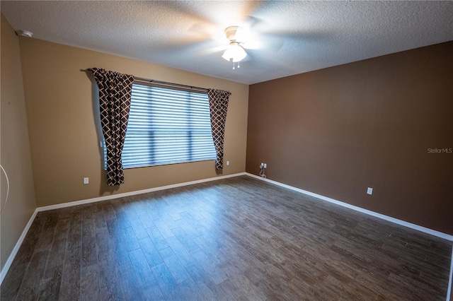 spare room featuring ceiling fan, a textured ceiling, and dark hardwood / wood-style floors