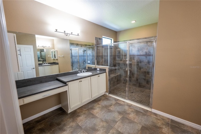 bathroom with vanity and an enclosed shower