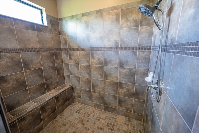 bathroom featuring a tile shower