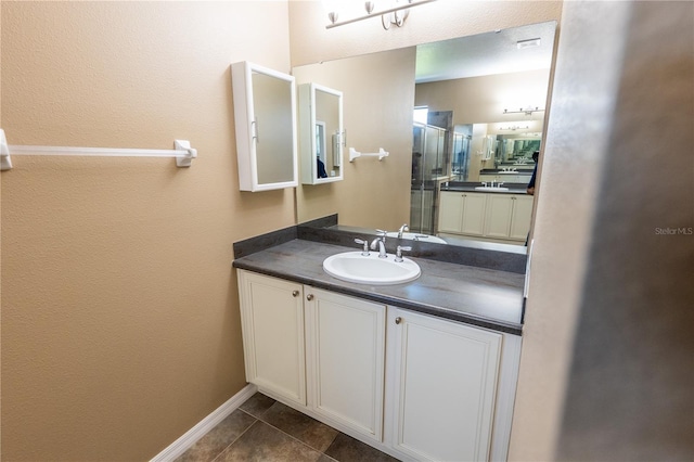 bathroom featuring tile patterned floors and vanity