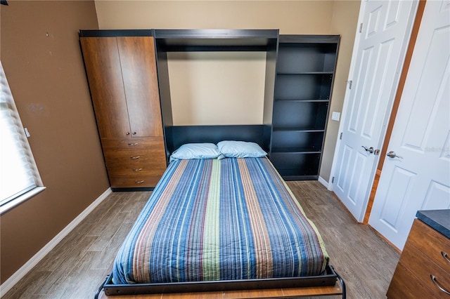 unfurnished bedroom featuring hardwood / wood-style flooring