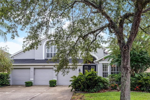 obstructed view of property featuring a garage