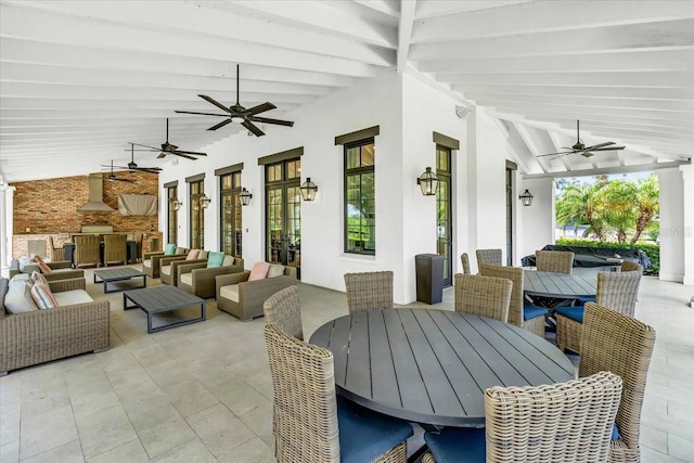 view of patio / terrace featuring an outdoor living space, ceiling fan, and french doors