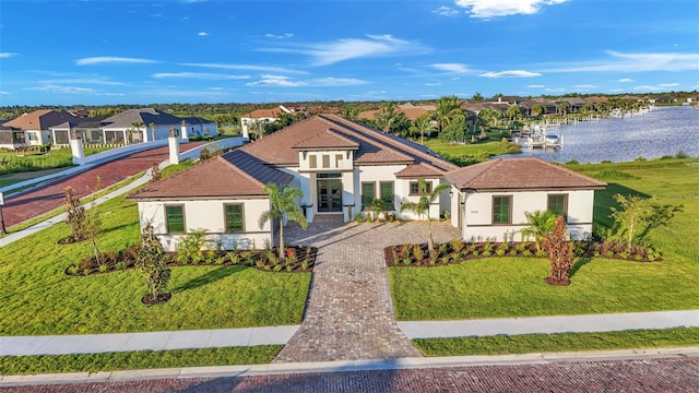 mediterranean / spanish-style home featuring a front lawn