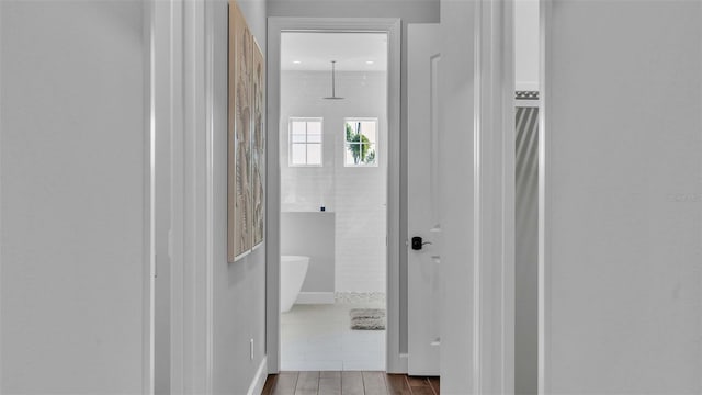 hallway with light wood-type flooring