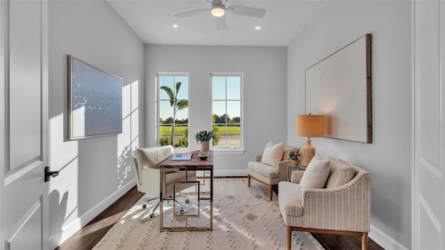 sitting room featuring wood-type flooring and ceiling fan