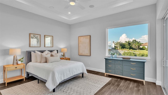 bedroom featuring ceiling fan and dark wood-type flooring