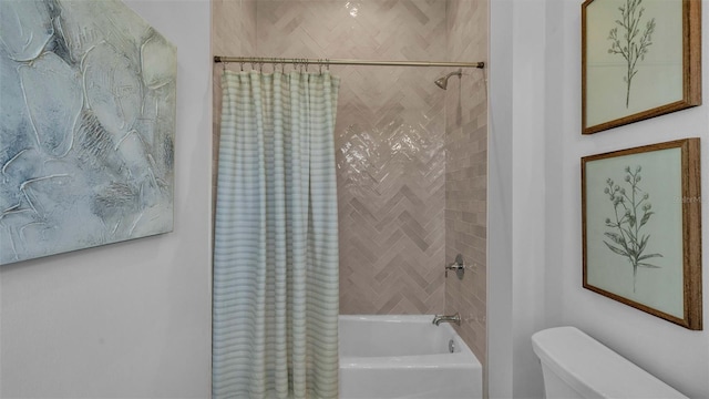 bathroom featuring shower / tub combo with curtain and toilet