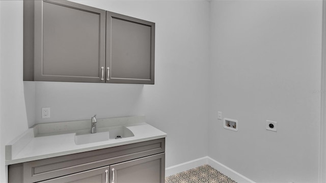 1529 Rio Vista Ter, Parrish, FL 34219 - laundry room with washer hookup, electric dryer hookup, cabinet space, a sink, and baseboards