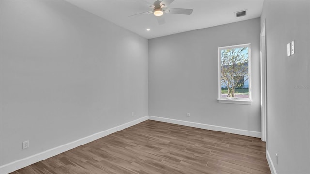 empty room featuring light wood-type flooring and ceiling fan