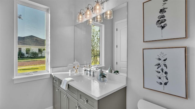 1529 Rio Vista Ter, Parrish, FL 34219 - bathroom with toilet, a chandelier, and vanity