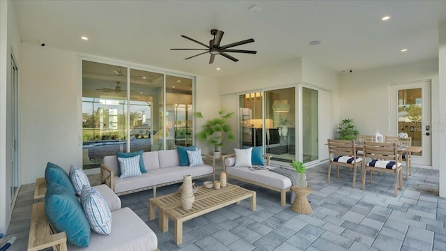 view of patio with ceiling fan and outdoor lounge area