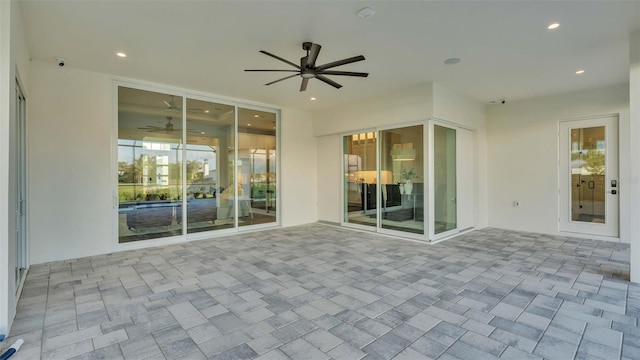 view of patio featuring ceiling fan