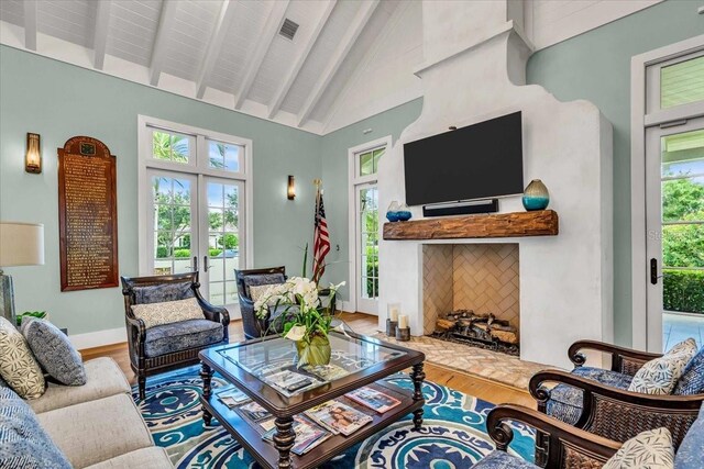 1529 Rio Vista Ter, Parrish, FL 34219 - living room with high vaulted ceiling, french doors, wood finished floors, beamed ceiling, and visible vents