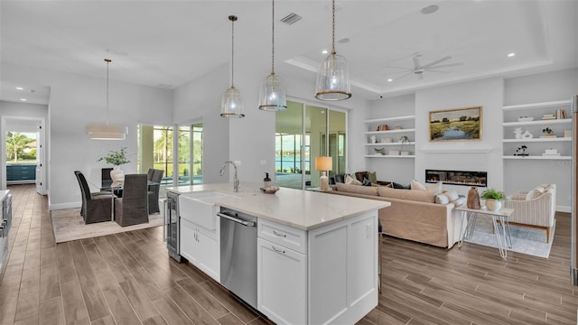 1529 Rio Vista Ter, Parrish, FL 34219 - kitchen with dark wood-style flooring, ceiling fan, dishwasher, beverage cooler, and visible vents