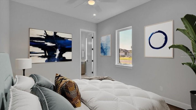 1529 Rio Vista Ter, Parrish, FL 34219 - bedroom featuring connected bathroom, a ceiling fan, baseboards, and wood finished floors
