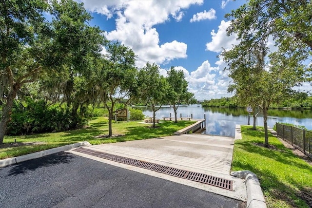 1529 Rio Vista Ter, Parrish, FL 34219 - view of community featuring a lawn, a water view, fence, and a boat dock