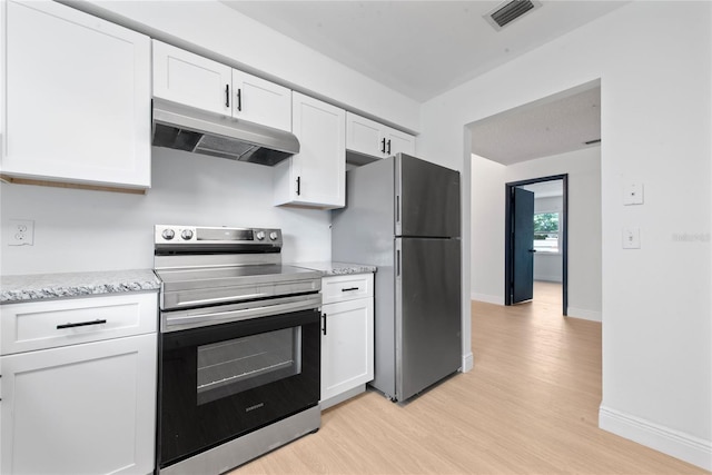 kitchen featuring appliances with stainless steel finishes, light wood-type flooring, light stone counters, and white cabinetry