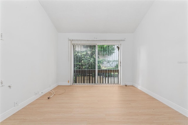 spare room featuring light wood-type flooring