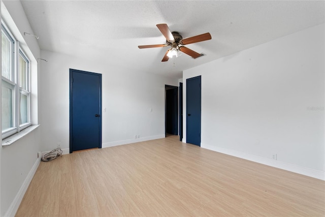 unfurnished room featuring ceiling fan and light hardwood / wood-style floors