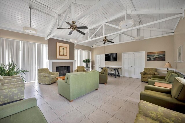 tiled living room with beam ceiling, high vaulted ceiling, ceiling fan, and a wealth of natural light