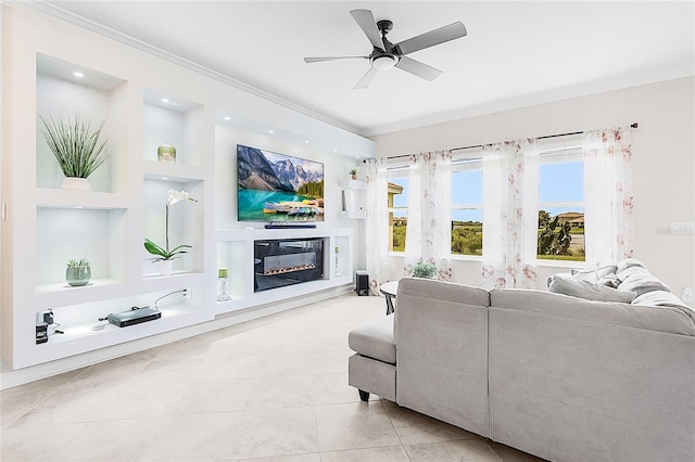 tiled living room with built in features, crown molding, and ceiling fan