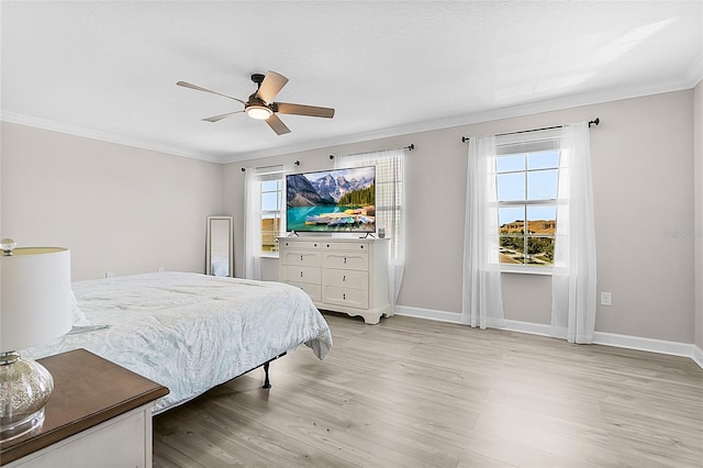 bedroom with ornamental molding, ceiling fan, and light hardwood / wood-style floors