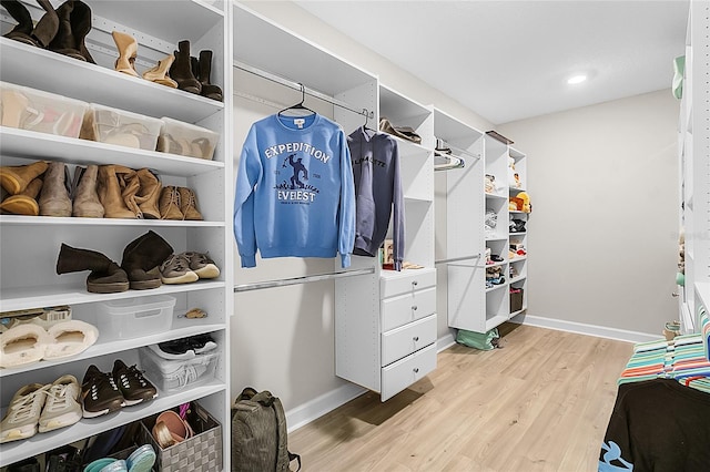 spacious closet featuring light wood-type flooring