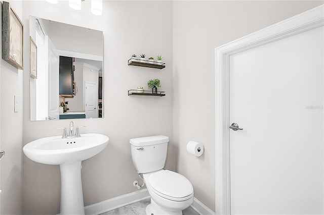 bathroom featuring tile patterned floors and toilet