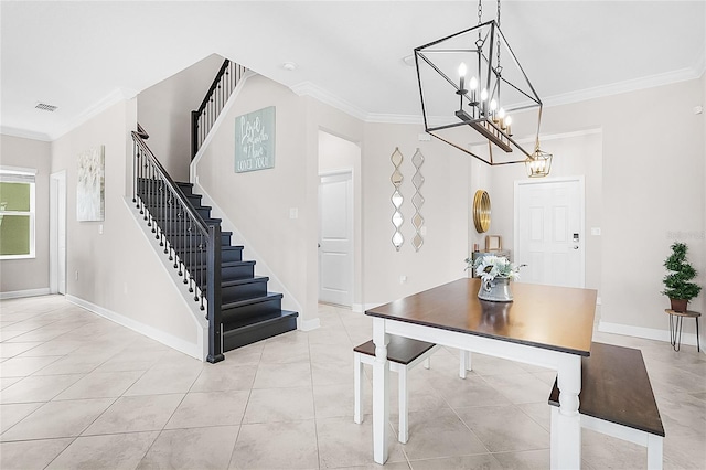 tiled dining space with an inviting chandelier and ornamental molding