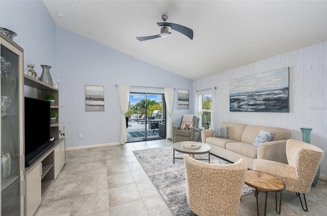 living room featuring lofted ceiling, light tile patterned floors, and ceiling fan