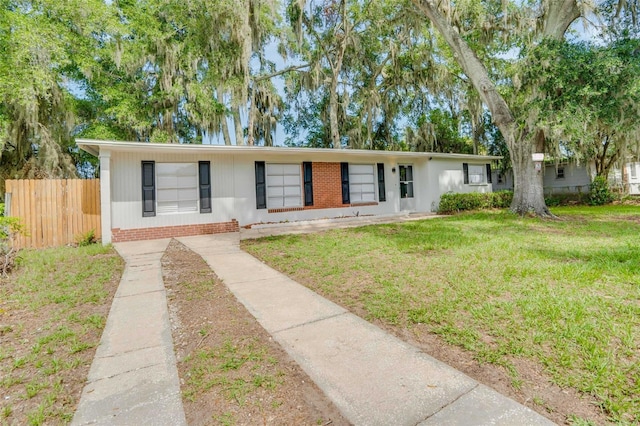 ranch-style house with a front lawn