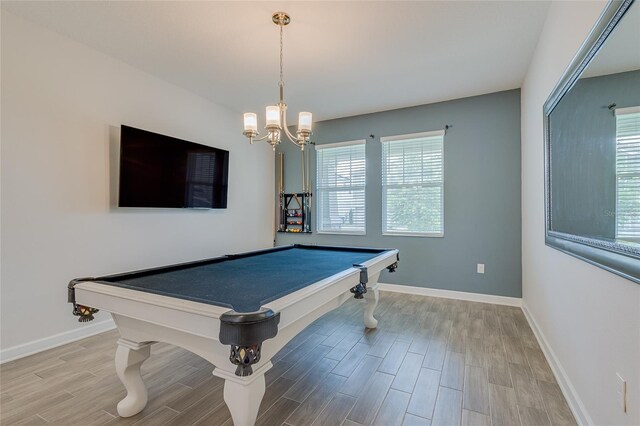 recreation room with a chandelier, pool table, and light wood-type flooring