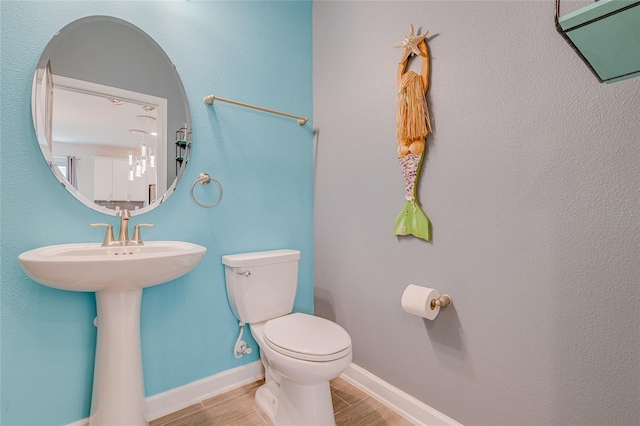 bathroom featuring tile patterned flooring and toilet