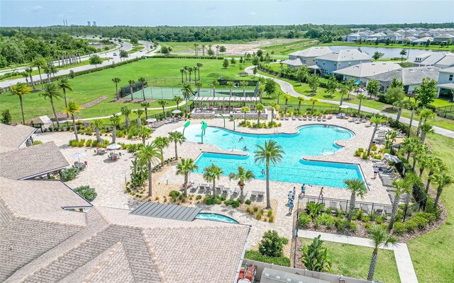 view of pool featuring a yard and a patio