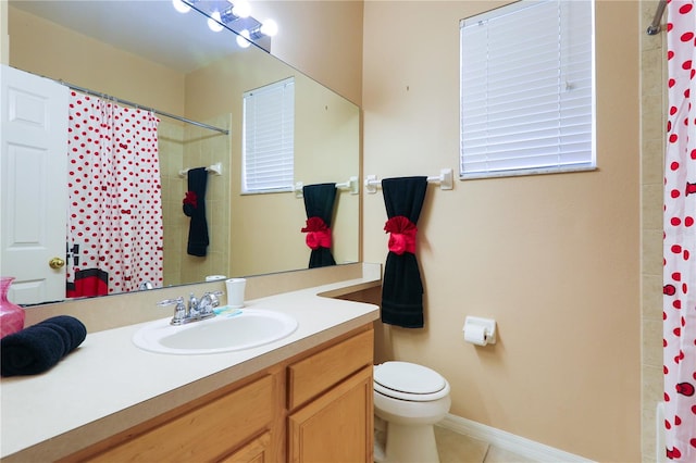 bathroom featuring vanity, a shower with curtain, tile patterned floors, and toilet