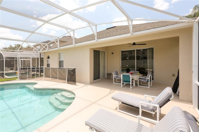 back of property with a lanai, ceiling fan, and a patio area