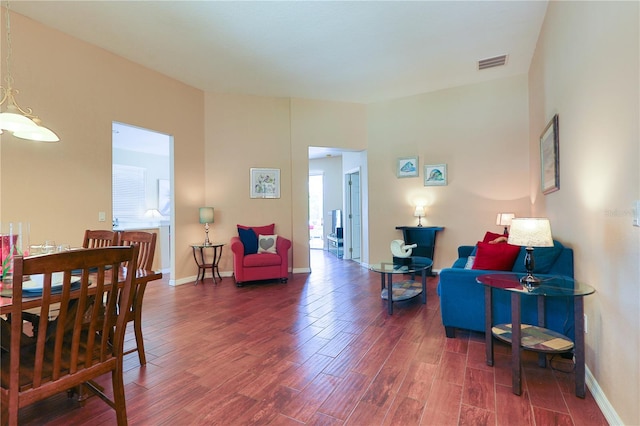 living room with dark hardwood / wood-style floors