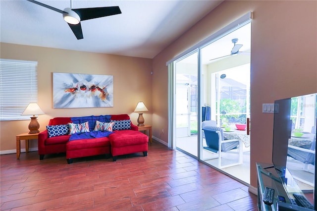 living room with hardwood / wood-style flooring and ceiling fan