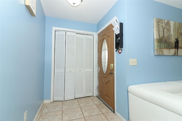 foyer entrance featuring light tile patterned floors