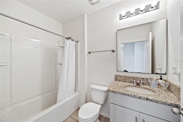 full bathroom featuring vanity, a textured ceiling, shower / bath combo with shower curtain, and toilet