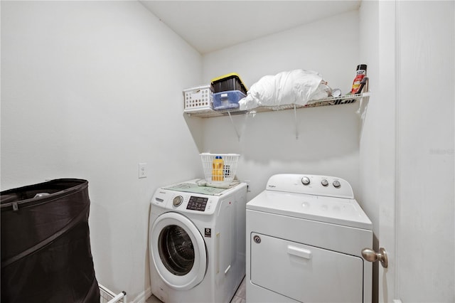 laundry room with washer and dryer