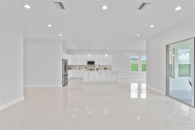 kitchen with visible vents, recessed lighting, white cabinets, appliances with stainless steel finishes, and tasteful backsplash